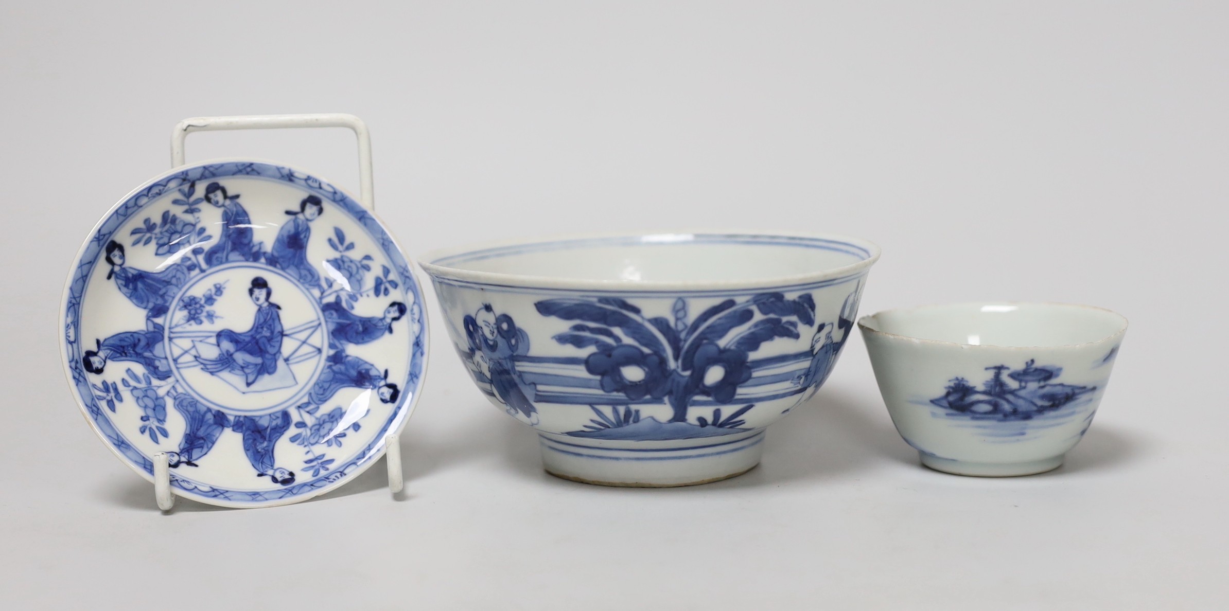 A Chinese Kangxi blue and white tea bowl and saucer, and a blue and white bowl, largest 13cm diameter